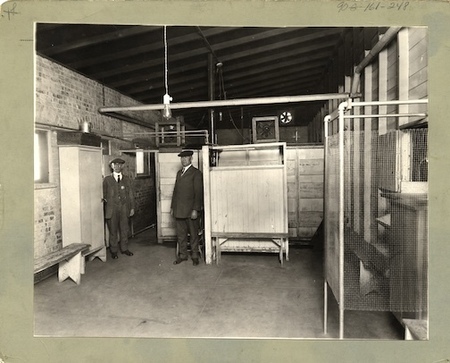 "Quarantine Station, El Paso, Texas. View of mens' undressing room, with shower baths and dressing room in distance."